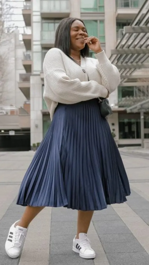 black woman pleated skirt with sneakers