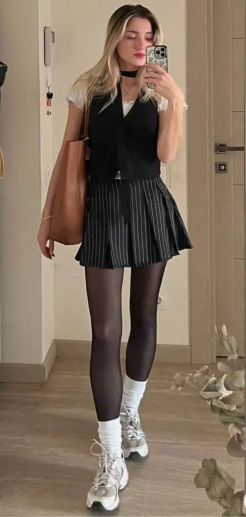 mini skirt and sneakers with sheer tights