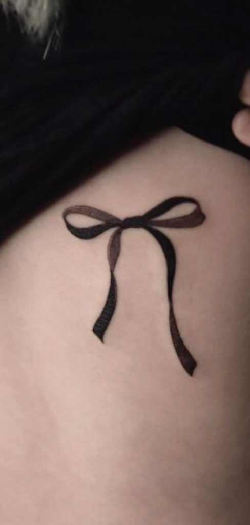 elegant bow tattoo design